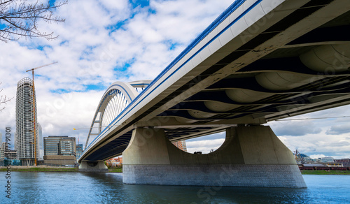 Old Bridge, or Starý most over the Danube, dedicated pedestrian and cycle paths with views of Old Town skyline in Bratislava, Slovakia photo