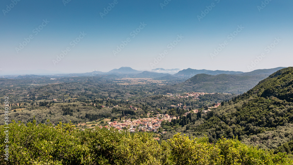 Beautiful landscape inside Corfu Island, Grece with small town between mountains