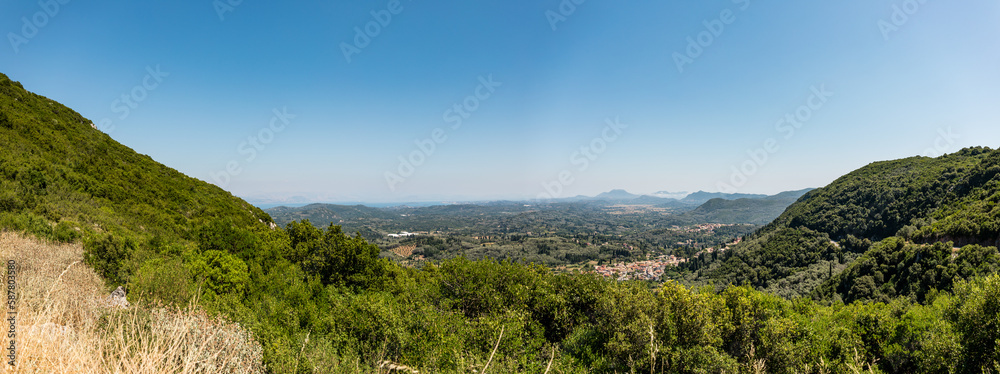 Beautiful landscape inside Corfu Island, Grece with small town between mountains