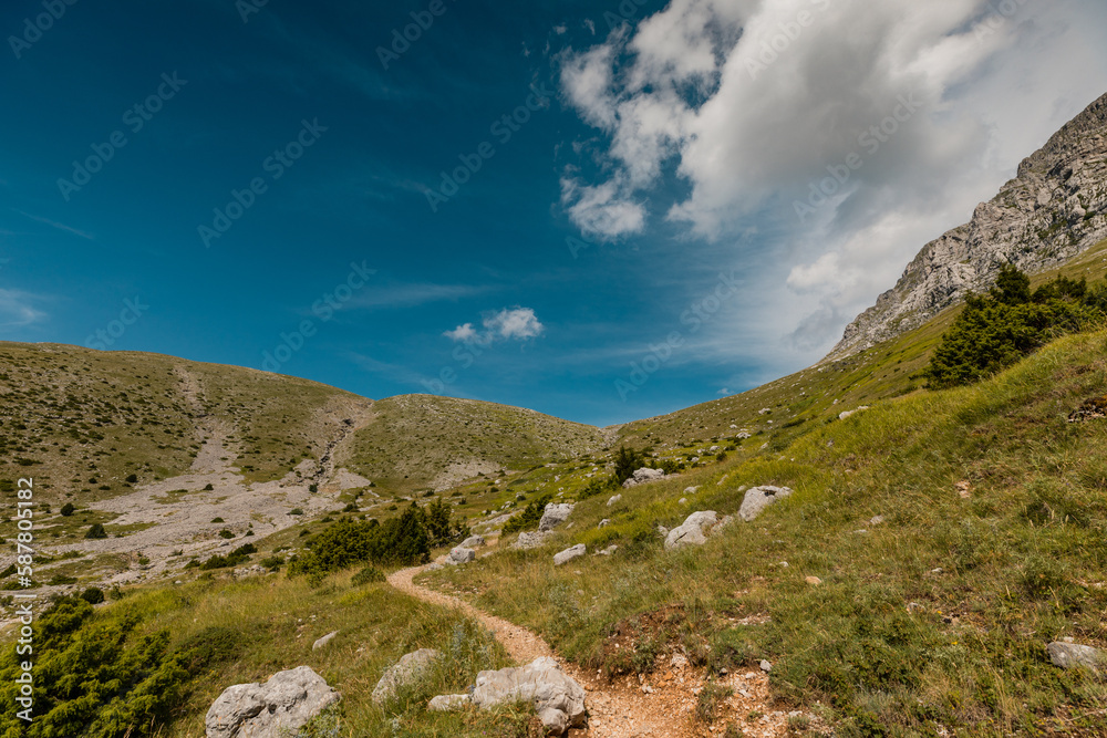 Mountain path in Vikos National Park near Tymfi's mountain refuge in Pindus Mountain, Greece Mountain path in Vikos National Park near Tymfi's mountain refuge in Pindus Mountain, Greece