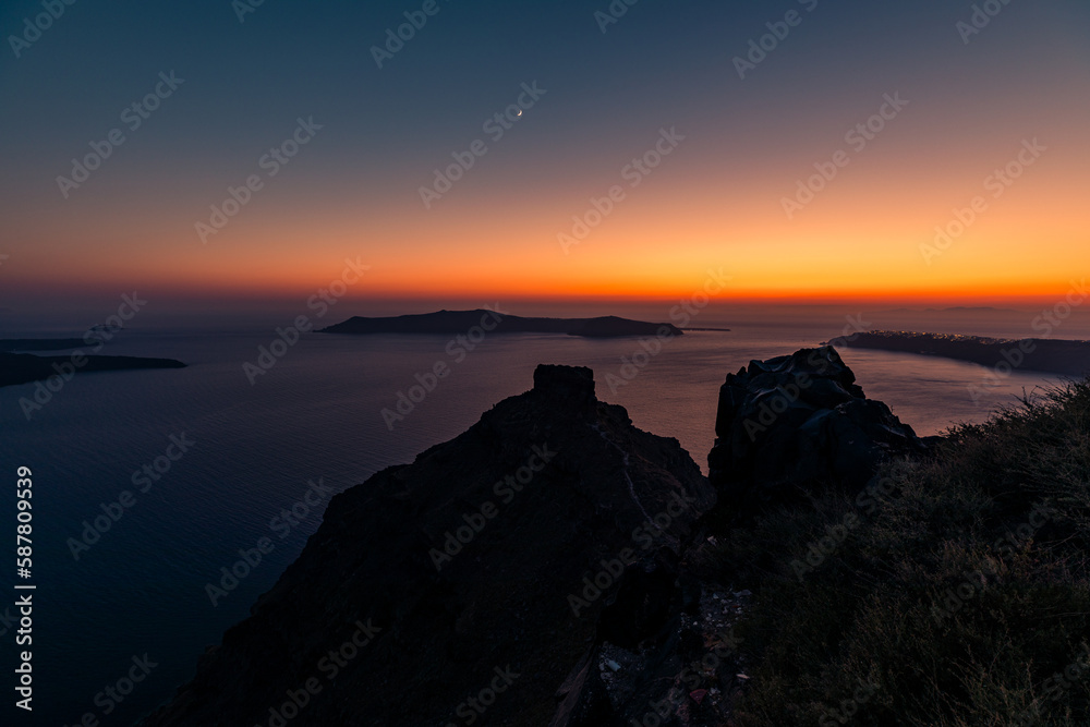 Santorini, Grece - July 23, 2020 - Amazing red sunset over Oia and caldera of the Santorini island, Greece Santorini, Grece - July 23, 2020 - Amazing red sunset over Oia and caldera of the Santorini island, Greece