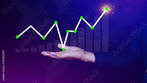 Businessman drawing growth curve, growth forecast chart, bussiness success concept. Hand drawing a graph representing increasing profits.