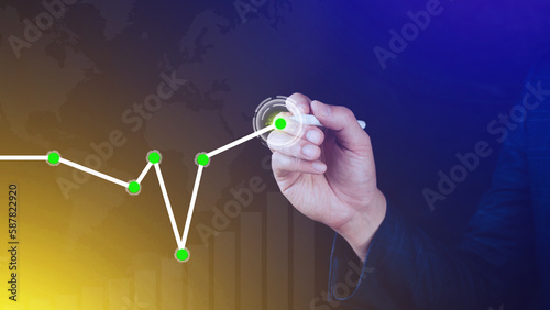 Businessman drawing growth curve, growth forecast chart, bussiness success concept. Hand drawing a graph representing increasing profits.