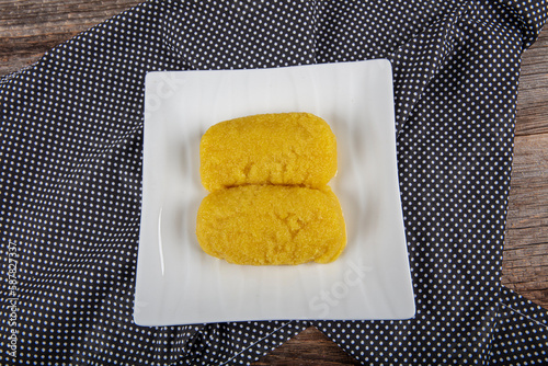 Cheese dessert on a dark background. Traditional Middle Eastern cuisine flavors. Cheese halva. Local name peynir helvası yada peynir tatlısı photo