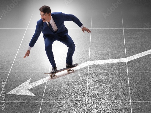 Businessman riding skateboard on financial graph