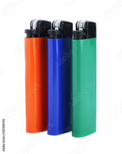 Stylish small pocket lighters on white background