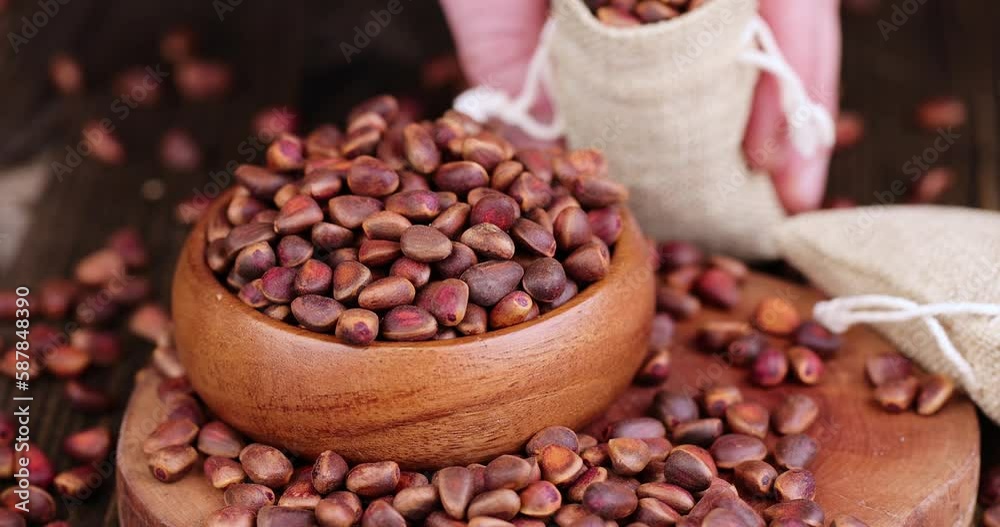 Unpeeled pine nuts after harvest, useful cedar nuts, unpeeled in a hard shell