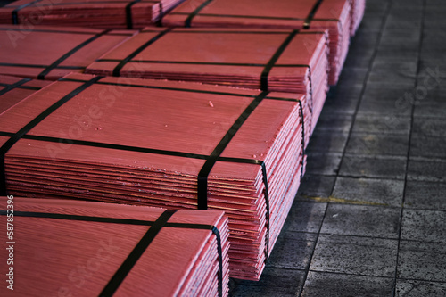 Piles of cathode copper plates at metal purification plant photo