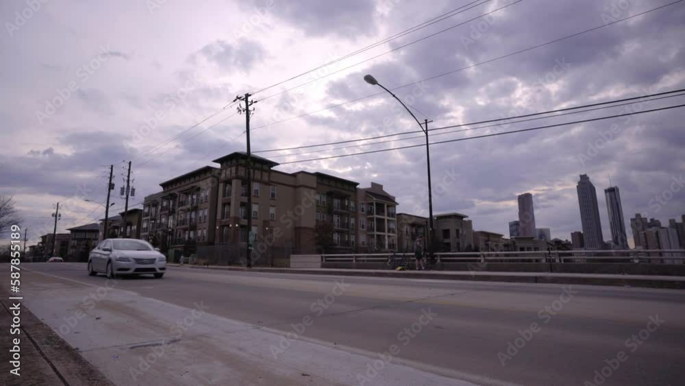Lockdown Shot Of Residential Buildings Seen From Highway Bridge In City Under Clouds - Atlanta, Georgia Lockdown Shot Of Residential Buildings Seen From Highway Bridge In City Under Clouds - Atlanta, Georgia