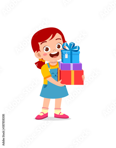 little kid holding stack of present box and walking