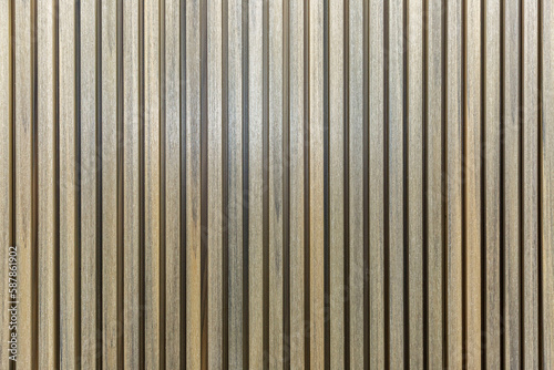 Slatted wooden wall panel. Modern ideas for decor and interior design  construction and renovation. Space for text. Front view.