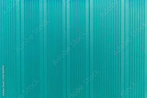 Lathed wall panel of bright turquoise color. Modern trends in interior design. Space for text. Front view.