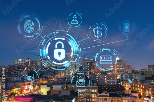 Roof top panoramic city view of San Francisco at night time, midtown skyline, California, United States. The concept of cyber security to protect confidential information, padlock hologram