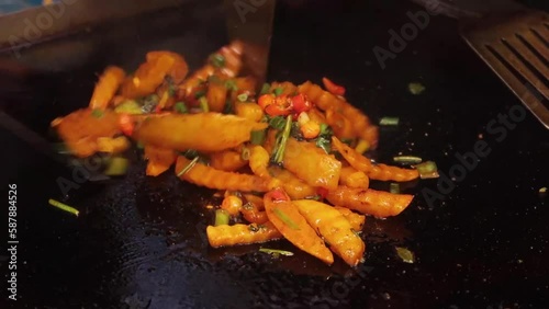 Szechuan Fries and fried tofu on iron plate