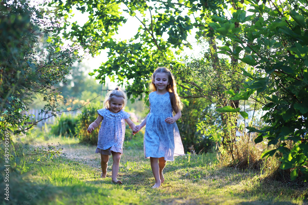 Children walk in the summer in nature. Child on a sunny spring morning in the park. Traveling with children. Children walk in the summer in nature. Child on a sunny spring morning in the park. Traveling with children.