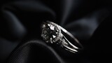 This image showcases a collection of diamond rings on a black cloth, with soft focus that creates a dreamy and romantic atmosphere.