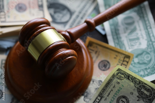 Fotografija judge gavel and money on brown wooden table concept