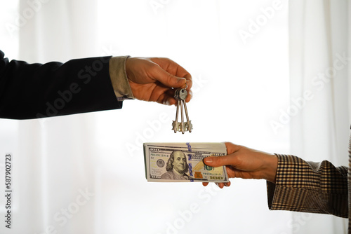 Two confident business man shaking hands during a meeting in the office, success, dealing, greeting and partner concept.