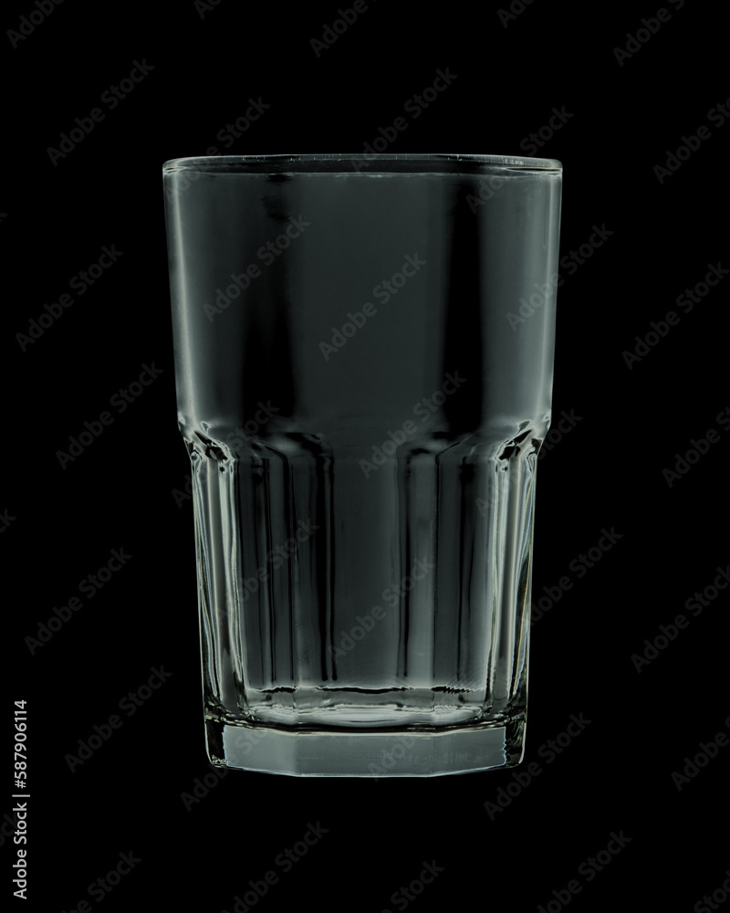Empty faceted glass isolated on black background. Closeup.