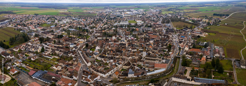 Aerial around the town of Nuits-Saint-Georges in France in early spring