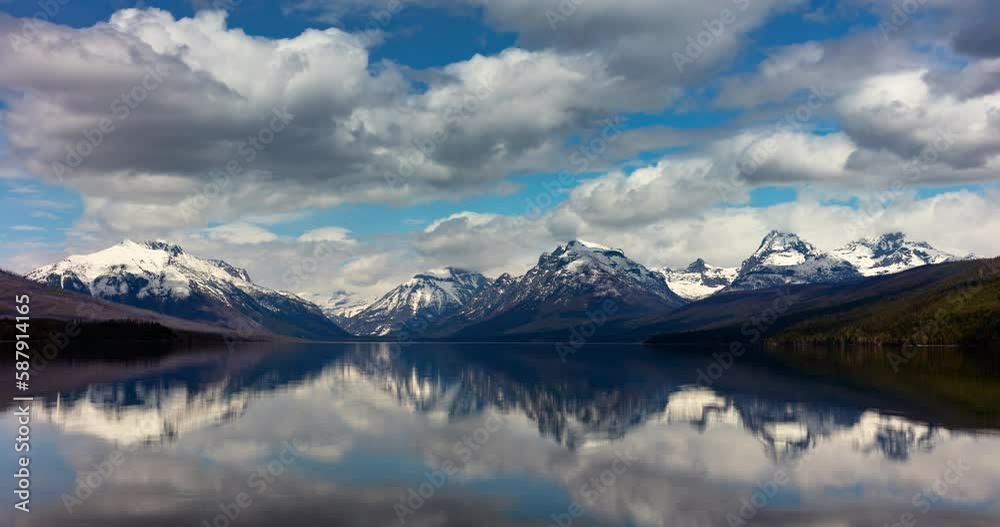 Timelapse Lockdown Of Billowing Morning Clouds Passing Over A Beautiful Lake With A Mountain Background - Glacier National Park, Montana