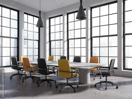 Stylish business room interior with table, armchairs and panoramic window