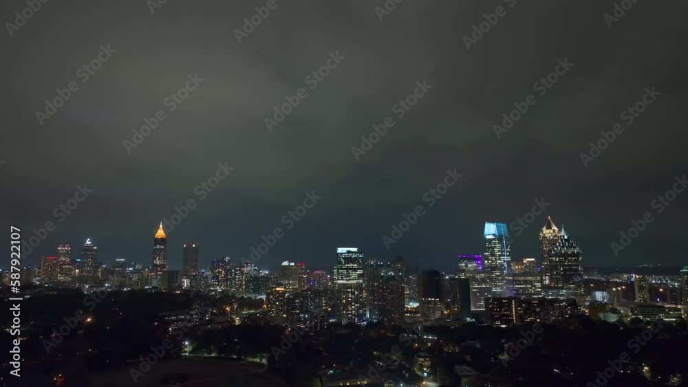 Night urban landscape of downtown district of Atlanta city in Georgia, USA. Skyline with brightly illuminated high skyscraper buildings in modern american megapolis Night urban landscape of downtown district of Atlanta city in Georgia, USA. Skyline with brightly illuminated high skyscraper buildings in modern american megapolis
