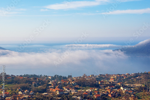 Clouds of mist over the sea. Beautiful Mediterranean landscape. Montenegro, Adriatic Sea, Herceg Novi.