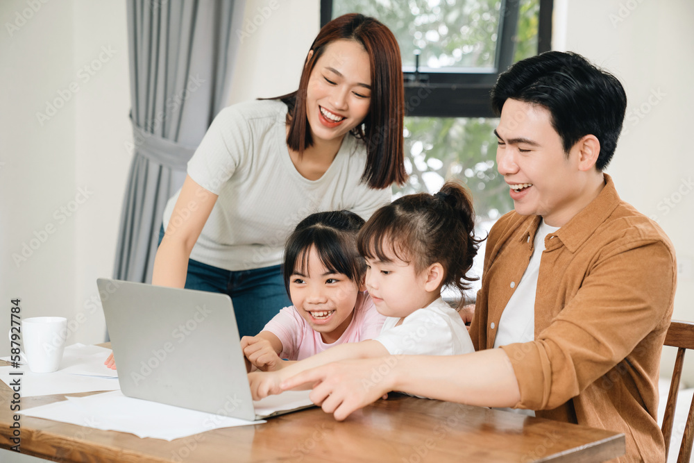 Young Asian family at home