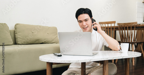 Image of young Asian man at home
