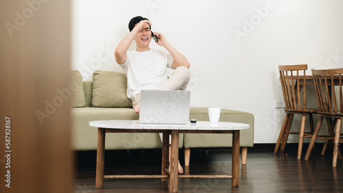 Image of young Asian man at home © Timeimage