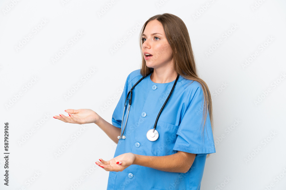 Young surgeon doctor Lithuanian woman isolated on white background with surprise facial expression Young surgeon doctor Lithuanian woman isolated on white background with surprise facial expression