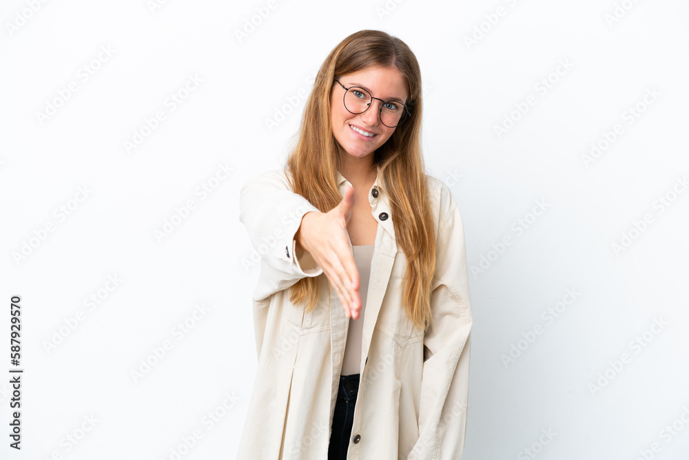 Young blonde woman isolated on white background shaking hands for closing a good deal