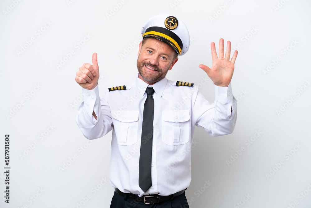 Airplane middle age pilot isolated on white background counting six with fingers Airplane middle age pilot isolated on white background counting six with fingers