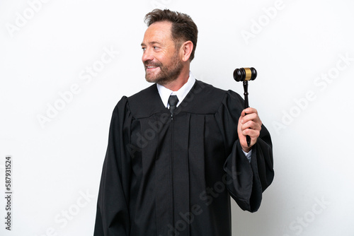 Middle age judge man isolated on white background looking side
