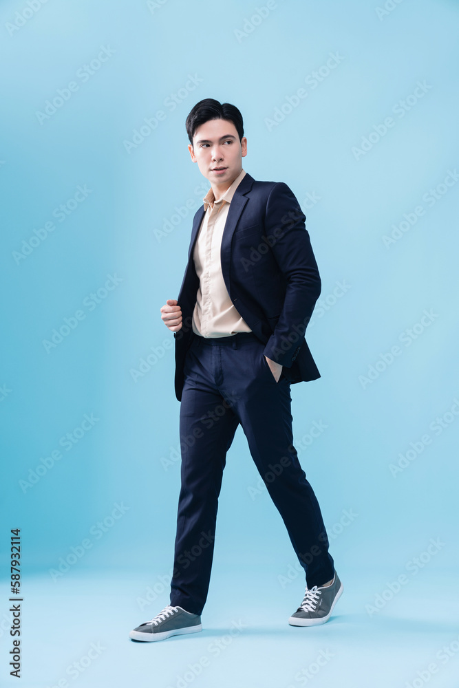Photo of young Asian businessman on background Photo of young Asian businessman on background