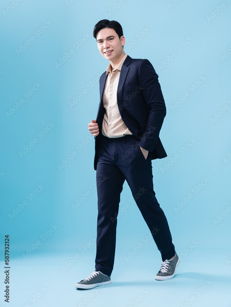 Photo of young Asian businessman on background Photo of young Asian businessman on background