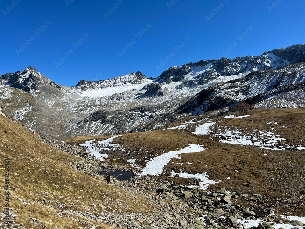First autumn snow on the rocky peaks in the mountainous area of the Albula Alps and above the Swiss mountain road pass Fluela (Flüelapass), Zernez - Canton of Grisons, Switzerland (Schweiz)