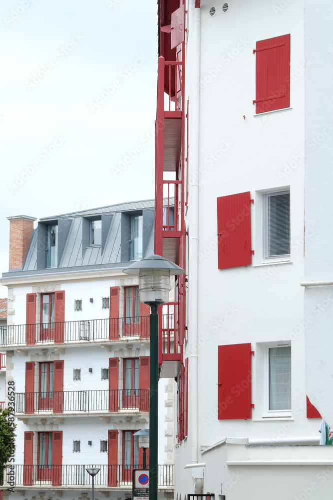 Obraz premium Saint-Jean de Luz, France - July 8th, 2023: The facades of the building of Saint-Jean de Luz in the french basque country.