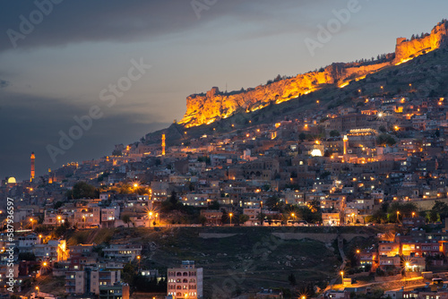 Panoramic view of Mardin at night with the citadel