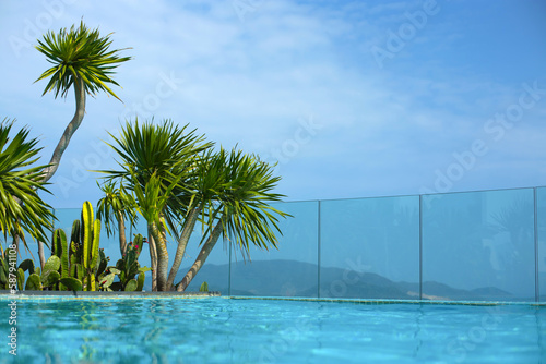 beautiful swimming pool landscape overlooking the islands and the sea or ocean  in a tropical country  in summer