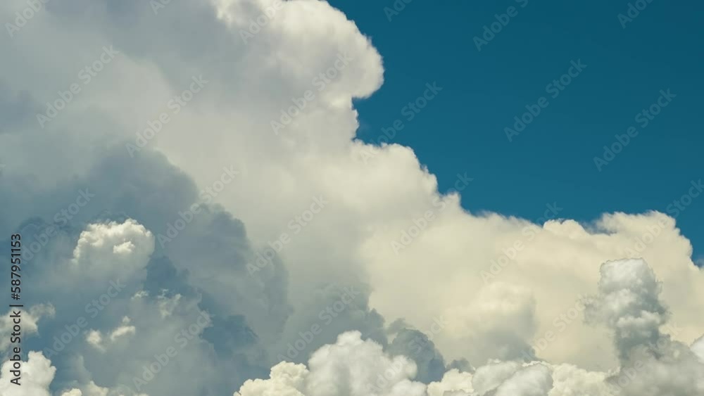 Timelapse of white puffy cumulus clouds forming on summer blue sky. Moving and changing cloudscape weather Timelapse of white puffy cumulus clouds forming on summer blue sky. Moving and changing cloudscape weather