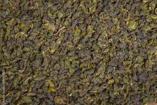 tea leaves on a rustic background. black tea, milk oolong, tea blend. Tea in wooden bowls © Artem Shunin