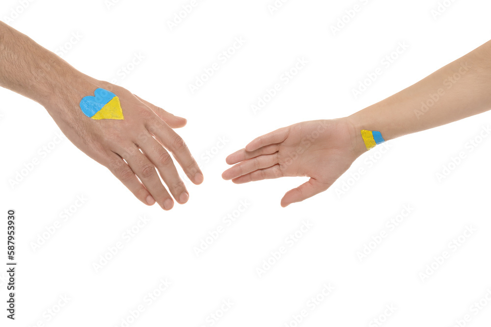 Man and woman with painted Ukrainian flags on their hands against white background, closeup
