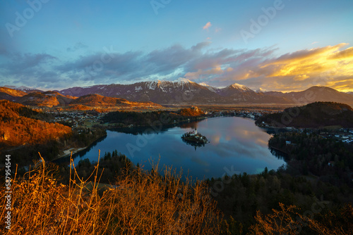 Aerial view of Lake Bled and Julian Alps, with Pilgrimage Church of the Assumption of Maria at sunrise, Slovenia © lkunl