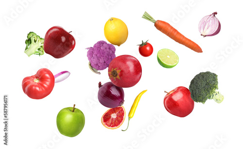 Many fresh vegetables and fruits falling on white background
