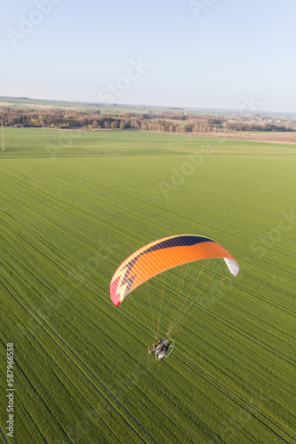 aerial view paraglider over the fields