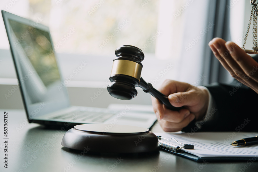 Judge gavel with Justice lawyers having team meeting at law firm background. Concepts of Law and Legal services. Judge gavel with Justice lawyers having team meeting at law firm background. Concepts of Law and Legal services.