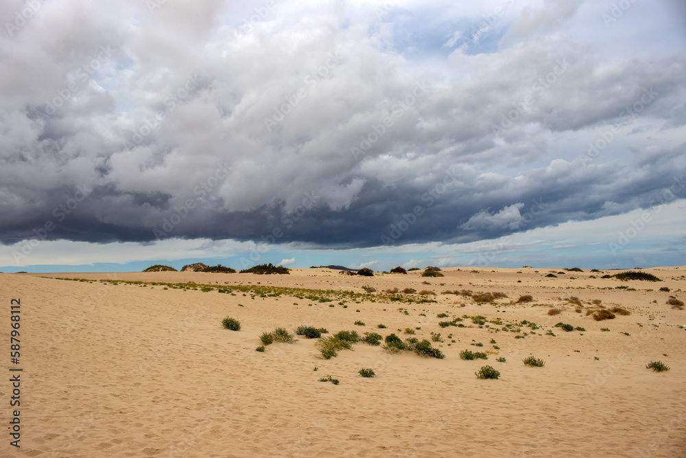 Sand dunes and cloudy sky, Fuerteventura, Spain Sand dunes and cloudy sky, Fuerteventura, Spain