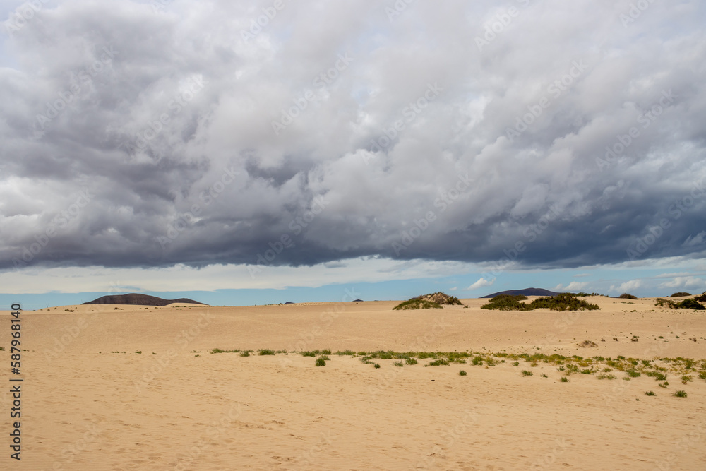 Sand dunes and cloudy sky, Fuerteventura, Spain Sand dunes and cloudy sky, Fuerteventura, Spain